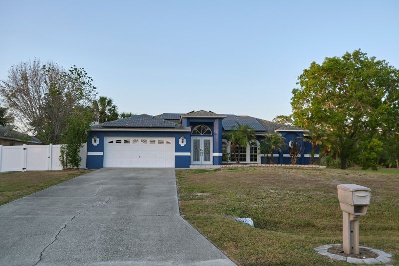 Freshly poured concrete driveway outside a single-storey Bundaberg home