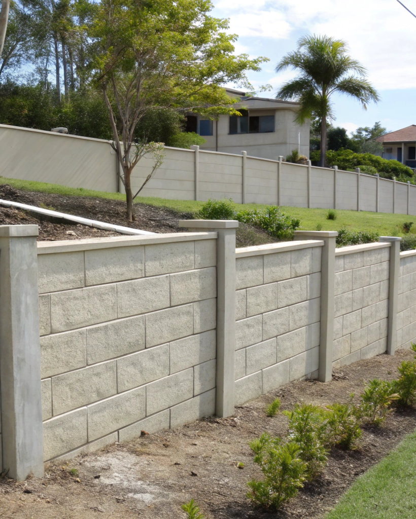 Reinforced concrete retaining wall on a sloped property