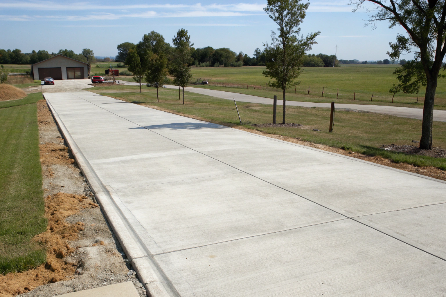 Rural concrete driveway built to handle heavy vehicle loads